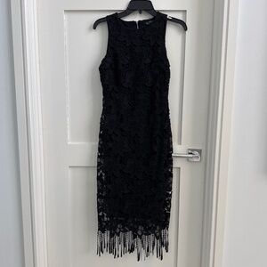 Elegant black lace form fitting dress by
